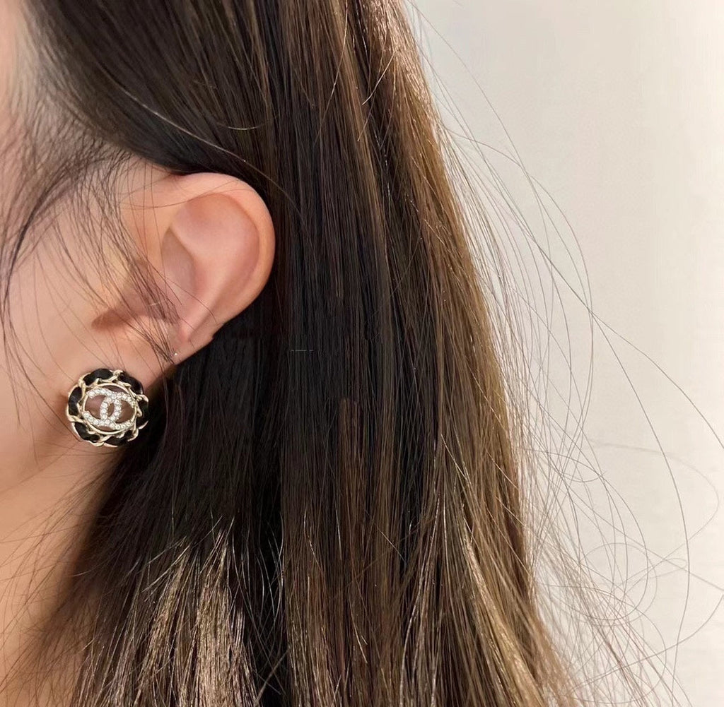 Chanel Black Leather Earrings - 18K Yellow Gold