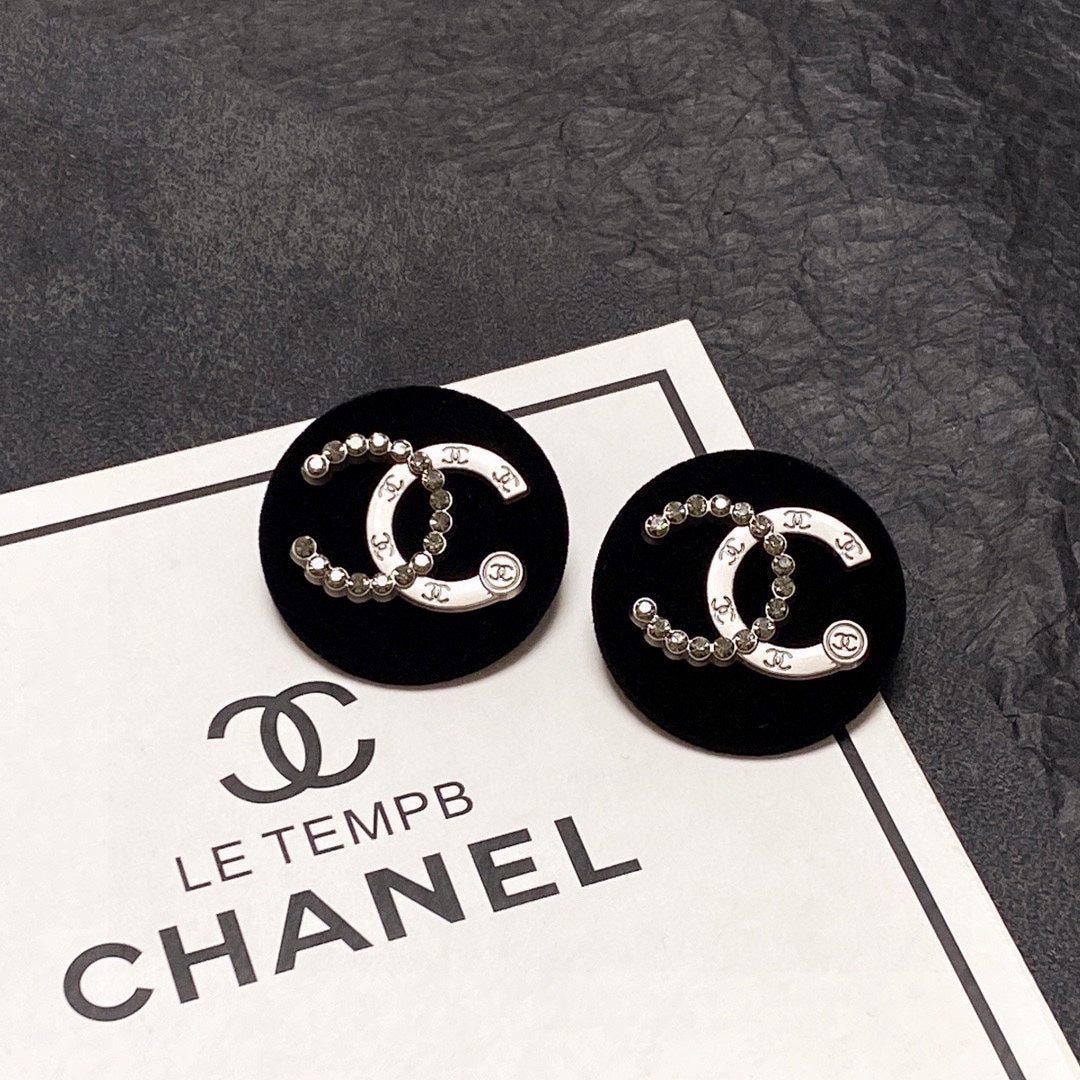 Chanel Black Resin Circle Earrings - 18K Yellow Gold