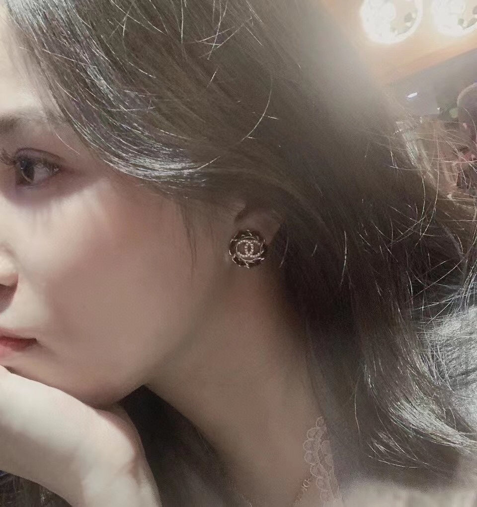 Chanel Black Leather Earrings - 18K Yellow Gold