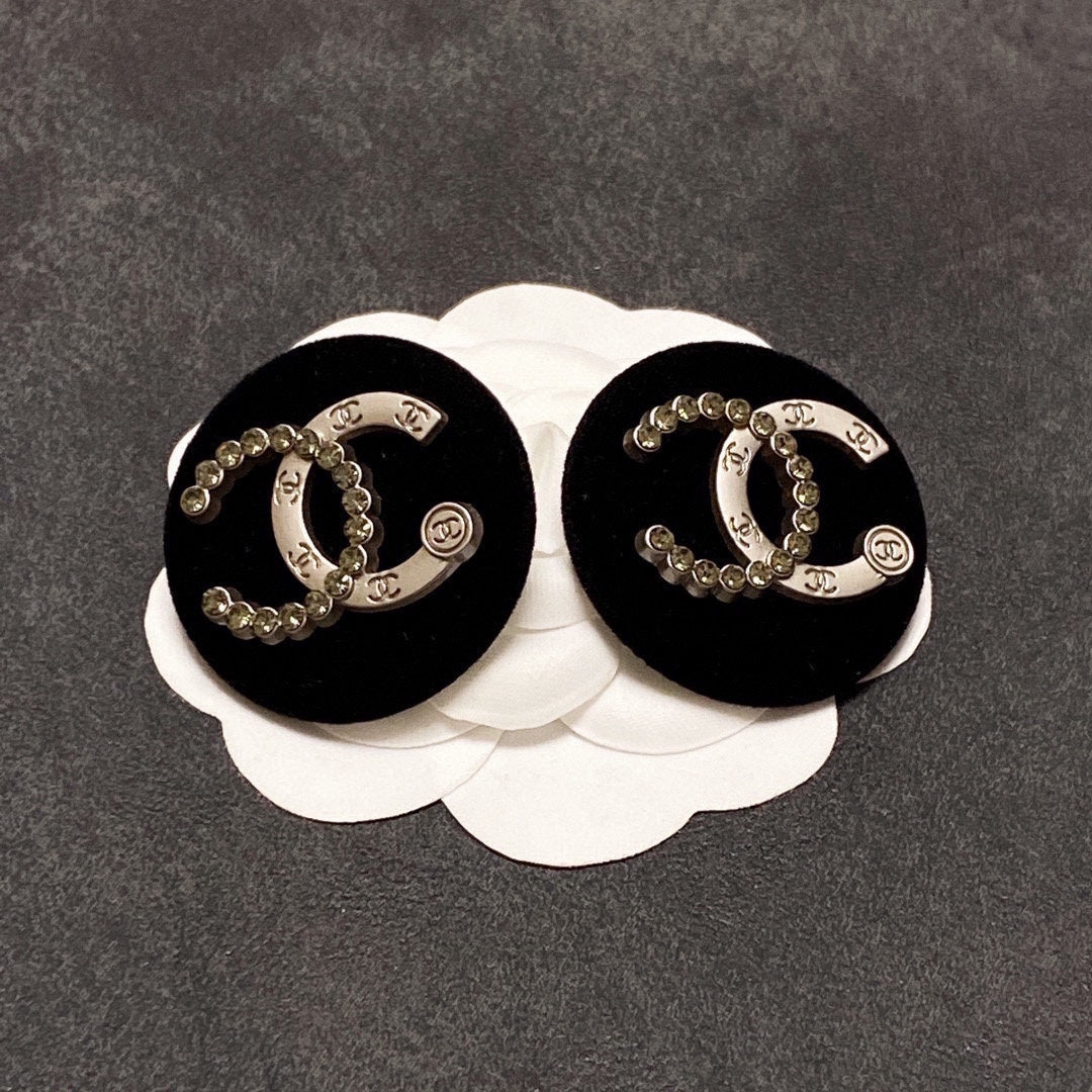 Chanel Black Resin Circle Earrings - 18K Yellow Gold