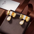 Celine Triomphe Butterfly Pearl Pendant Earrings - 18K Yellow Gold