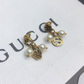 Gucci Double G Flower & Pearl Pendant Earrings - 18K Yellow Gold